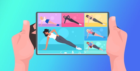 mix race women doing yoga fitness exercises on tablet screen online training healthy lifestyle concept human hands using mobile app horizontal vector illustration
