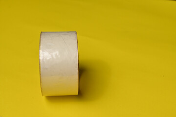 Transparent adhesive tape or strips isolated on yellow background