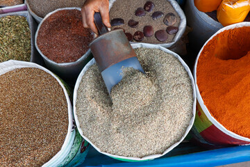 Stack of spices and herbs for sell in a market