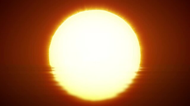 Beautiful clear big sunrise (sunset) close-up. Big red hot sun in the reflection of the sea over the horizon.