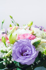 bouquet of multi-colored eustomas, copy space for text from above on a white background