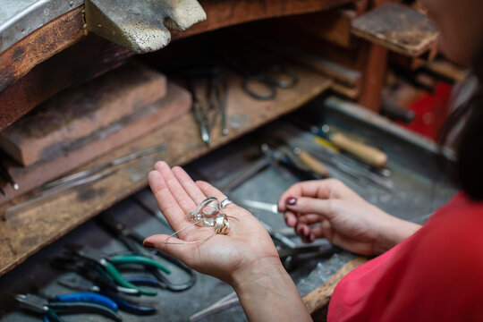Crop artisan showing silver jewelry