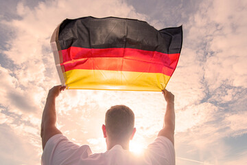 Man holding Flag of Germany, concept picture