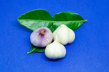 Onions, garlic and kaffir lime leaves are prepared for cooking