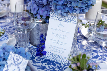 Banquet menu near decorations on table