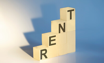Rent text on wooden blocks. The concept of renting housing. Rental. Saving money.