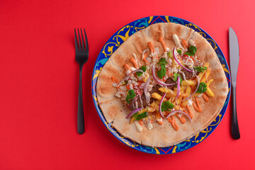 Lavash bread with grilled meat, vegetables, cheese. Shawarma lavash bread, fresh roll of lavash, pita bread.