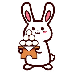 お供え物のお団子を持ったウサギ