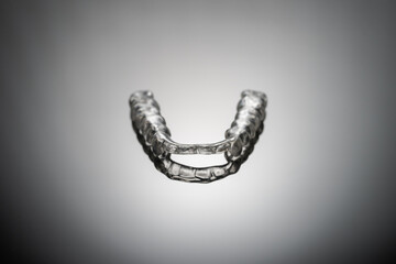 night dental guard by bruxism on gray background