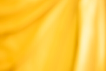 Golden yellow cotton fabric for a soft and smooth background. Elegant graphics.