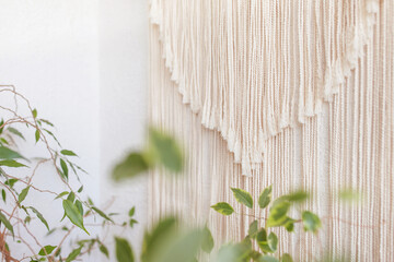 Close-up of hand made macrame texture pattern.  ECO friendly modern knitting DIY natural decoration concept  in the interior. Flat lay. Handmade macrame 100% cotton. Female hobby. Copy space