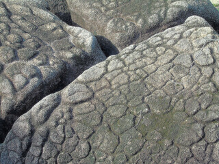 Huge rocks are located at the foot of the mountain

