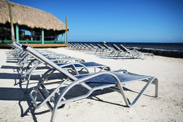 chairs  for relax on resort beach with view of Caribbean sea