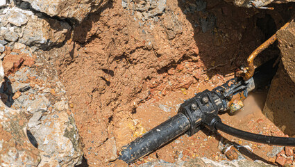 Severe water leaks from old cracked pipes in all directions.