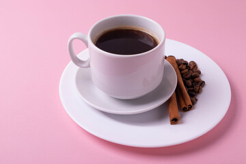 espresso in a white ceramic cup on pink