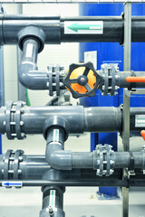 PVC pipeline an industrial city water treatment boiler room. Valves and pipe conections.