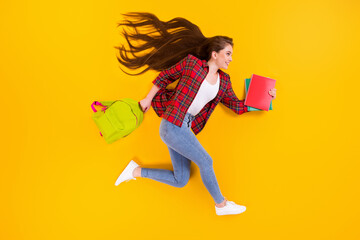 Top view above high angle flat lay flatlay lie concept of nice cheerful girl nerd running fast hurry rush late lesson course class isolated on bright vivid shine vibrant yellow color background
