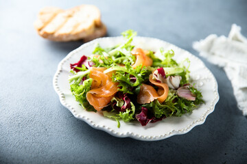 Healthy green salad with smoked salmon