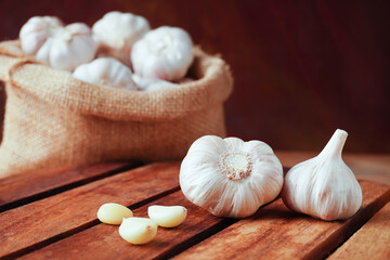 Garlic Cloves and Bulb on the wooden table.Healthy food concept.