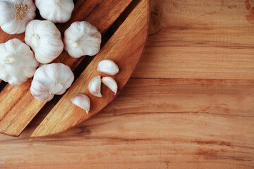Garlic Cloves and Bulb on the wooden table.Healthy food concept.