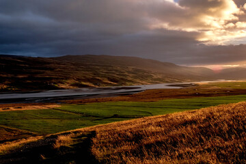 Obraz premium On the way up to the Litlanesfoss waterfall, East Iceland, a sunset landscape