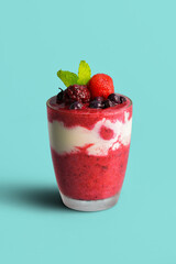 Mixed berry smoothie mixed with yogurt By blending thoroughly in clear glass With berries on top and for those who take care of their shape selective focus at fruits on top