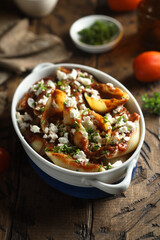 Homemade pasta bake with tomato sauce and cheese