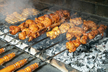 Grilling marinated shashlik on a grill. Shashlik is a form of Shish kebab