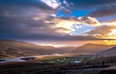 Fototapeta premium On the way up to the Litlanesfoss waterfall, East Iceland, a sunset landscape