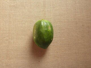 Green color whole raw unripe Papaya fruit