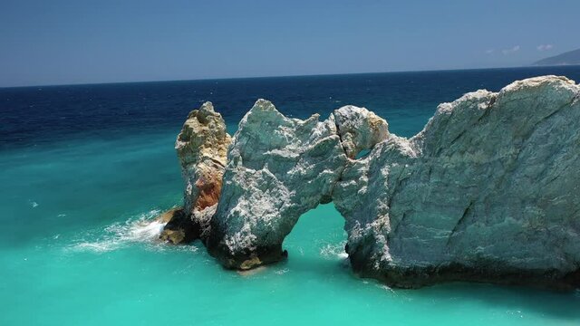 Aerial drone rotational video of Lalaria arch in famous turquoise beach, one of the most beautiful in Greece, Skiathos island, Sporades islands