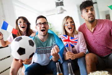 Group of multi-ethnic people celebrating football game