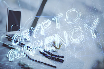 Double exposure of blockchain and crypto economy theme hologram and table with computer background. Concept of bitcoin cryptocurrency.