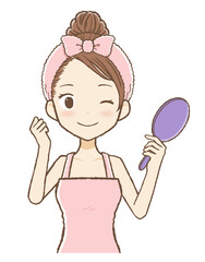 手鏡をもってガッツポーズのルームウエア女性　上半身