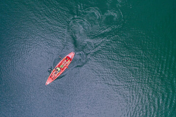 Kayak floats on the river view from the top, from the drone, two guys in the canoe