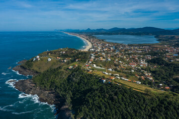 Long beach, lagoon, sea and hill. Picturesque landscape. Ponta Negra Beach, City of Ponta Negra, State of Rio de Janeiro, Brazil. 