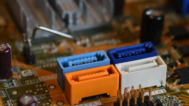 Technician connect the SATA Cable to the SATA Motherboard slot. Close-up