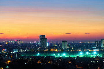 Cityscape of Hanoi skyline at Vinh Tuy bridge over Red river during sunset time