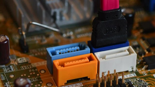 Technician disconnect the SATA Cable to the SATA Motherboard slot. Close-up