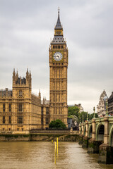 Fototapeta na wymiar Big Ben by Westminster Bridge and the River Thames on a cloudy day in London