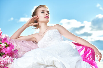 Fototapeta na wymiar graceful lady in white dress