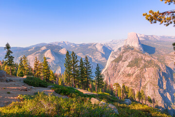 The aerial panorama of Washburn Point in Yosemite National Park, California, United States. View from Washburn Point: Half Dome, Liberty Cap, Yosemite Valley, and Nevada Fall.