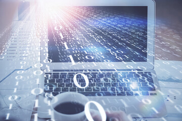 Double exposure of laptop computer and technology theme hologram. Concept of freelance work.