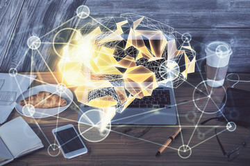 Multi exposure of work table with computer and brain hologram. Brainstorm concept.