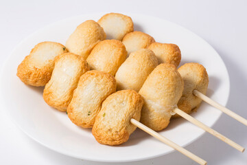 Fish cake skewer, isolated on white background.