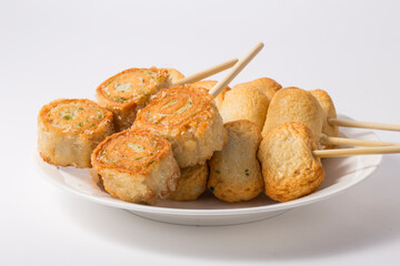 Fish cake skewer, isolated on white background.