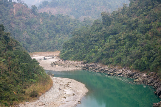 River of green water through mountains.
