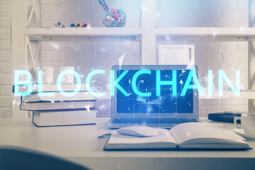 Multi exposure of blockchain theme hologram and table with computer background. Concept of bitcoin...