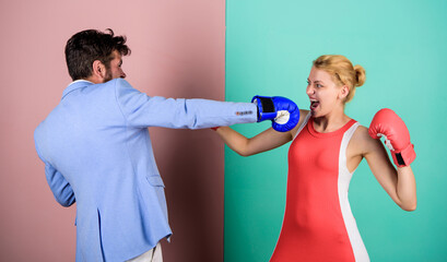 Gender battle. Gender equal rights. Family quarrel. Strong punch. Boxers fighting in gloves. Gender...