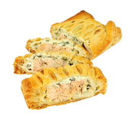 Sliced puff pastry covered salmon Wellington with cheese spinach filling isolated on a white background